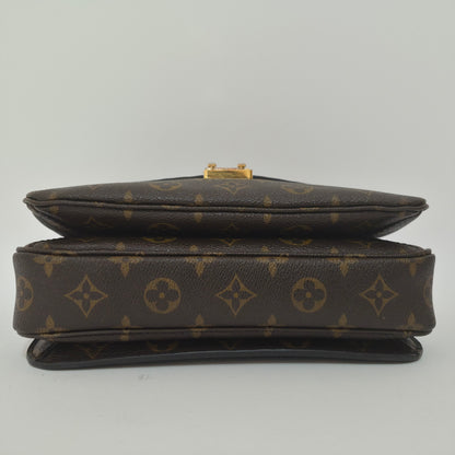Pochette métis in tela monogram