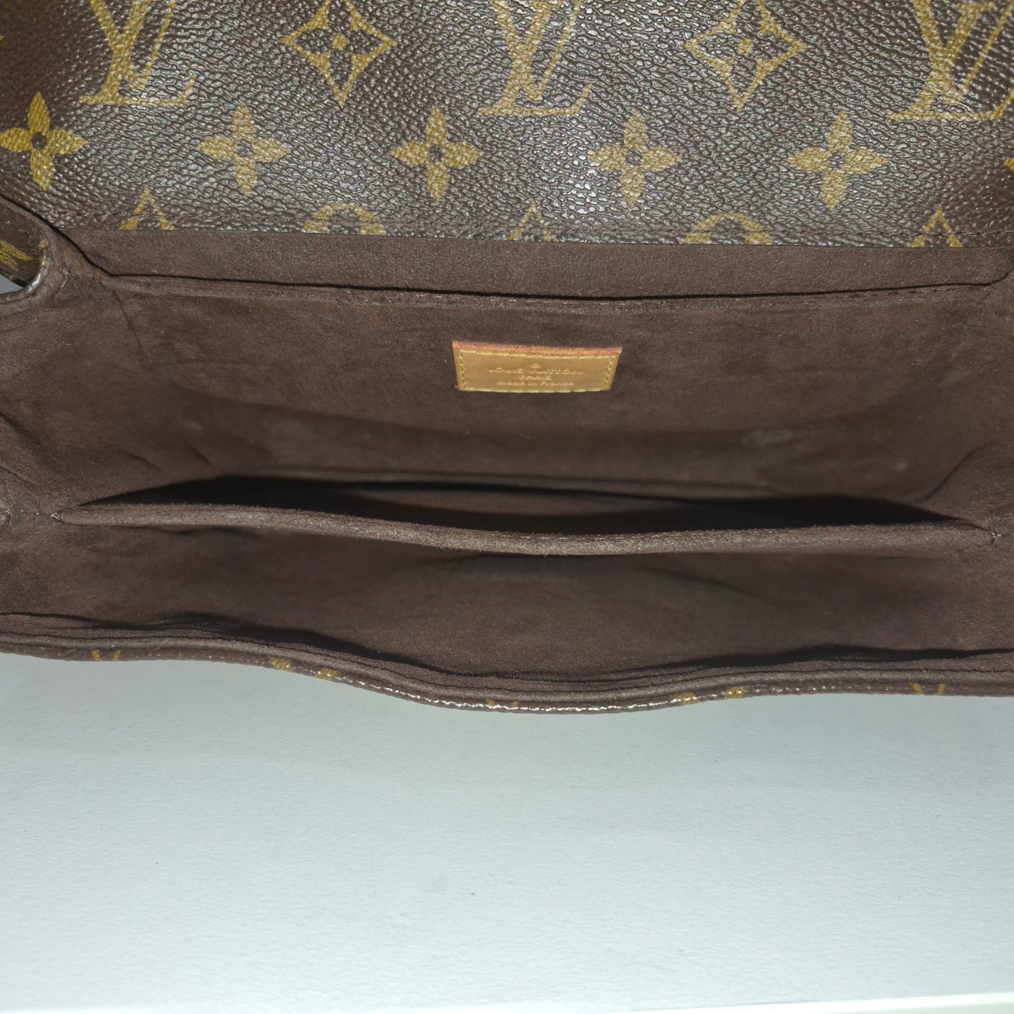Pochette métis in tela monogram