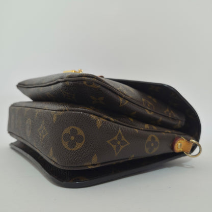 Pochette métis in tela monogram